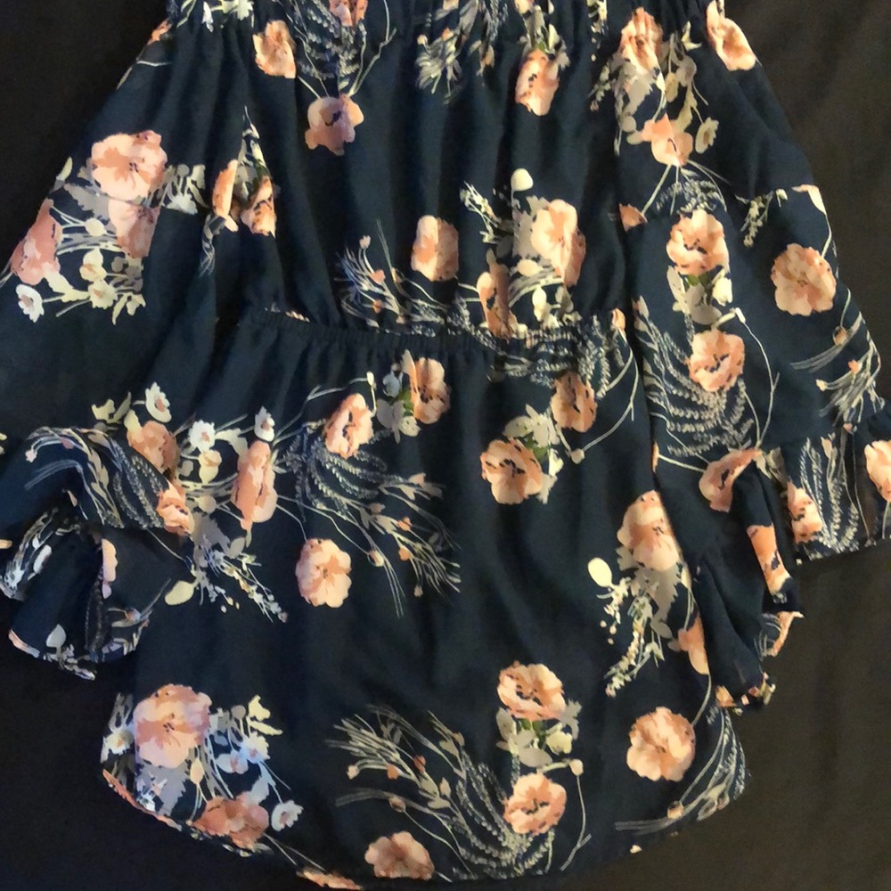 Brand is indulge in style, woman size medium, floral dress.